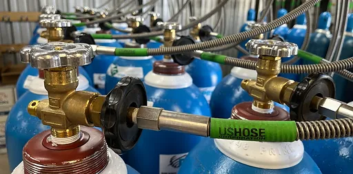 Rows of helium cylinders being prepared for refill and exchange service