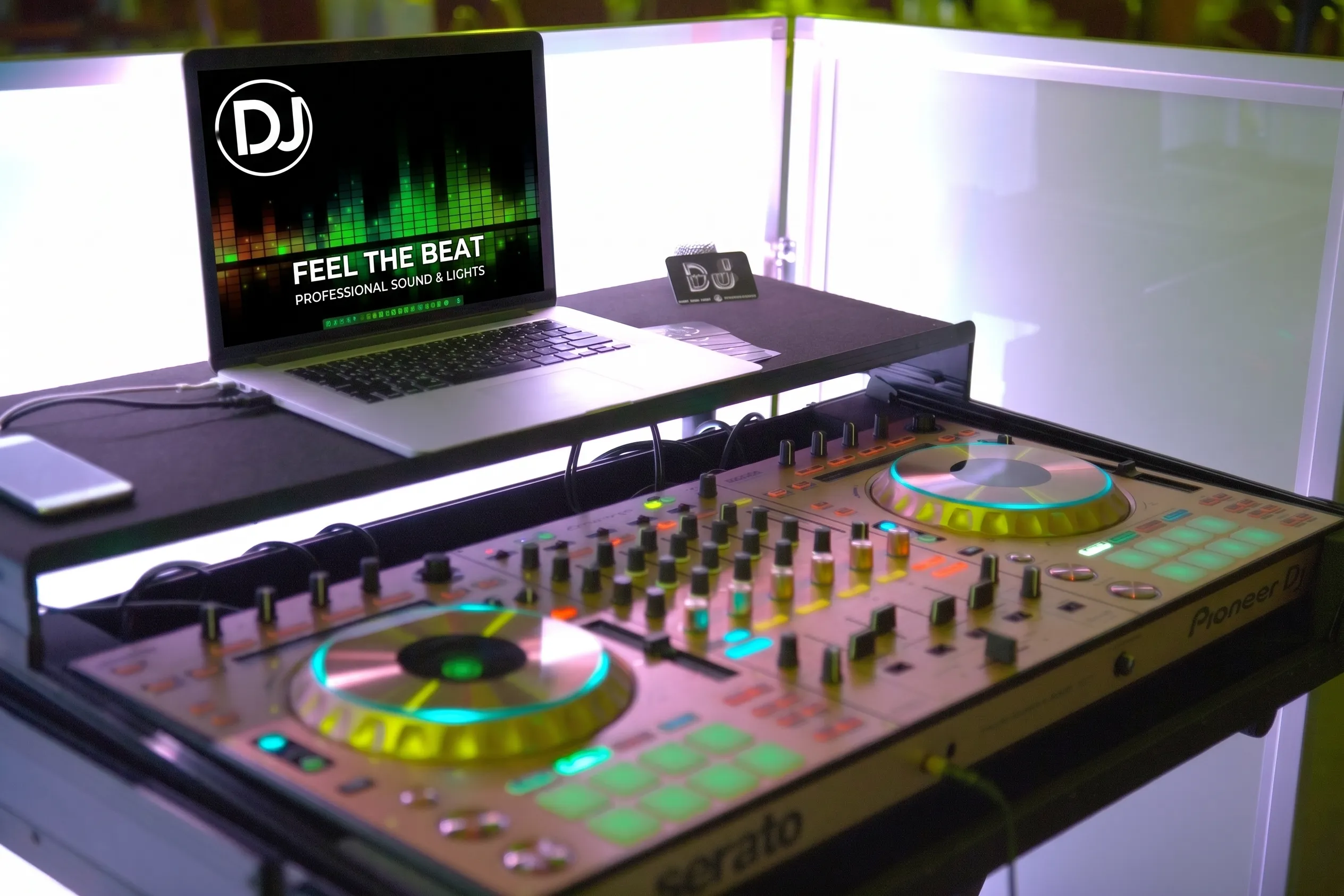 Gold Pioneer DDJ-SZ Serato DJ controller and laptop set up on a white lit DJ booth